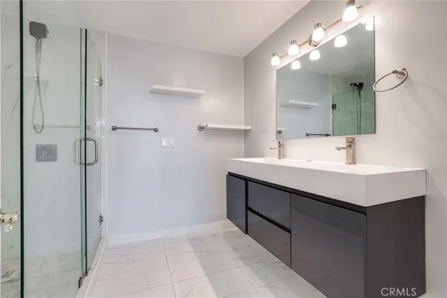a bathroom with a sink vanity and a mirror