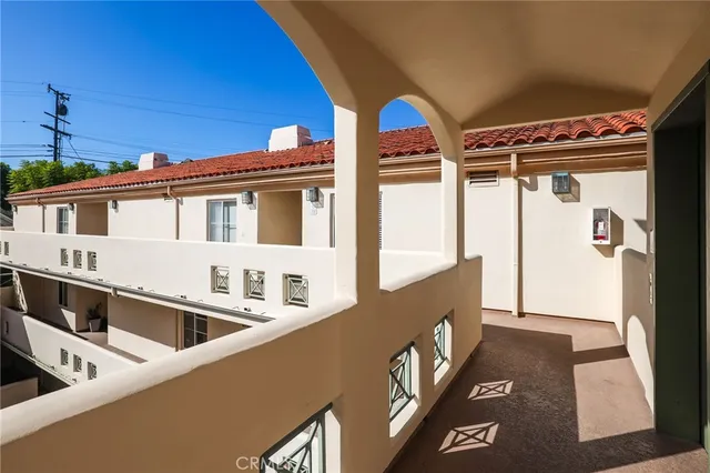 a front view of a house with large windows