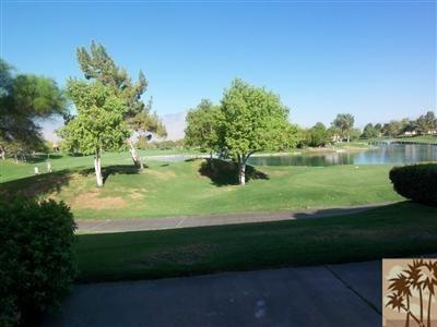 a view of a golf course with a lake