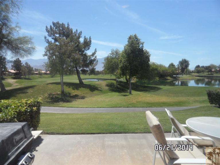 27 Oak Tree Drive Rancho Mirage, CA 92270 - Photo 15 of 21 a view of a table and chairs in the garden