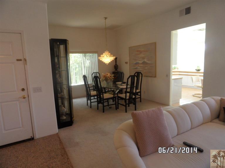27 Oak Tree Drive Rancho Mirage, CA 92270 - Photo 17 of 21 a dining room with furniture and window