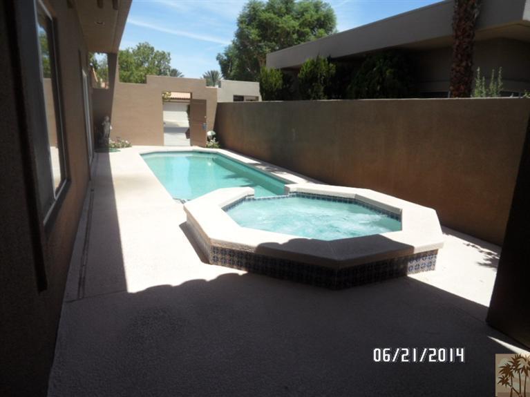 27 Oak Tree Drive Rancho Mirage, CA 92270 - Photo 19 of 21 a view of a swimming pool with a yard