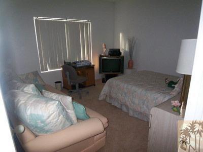 27 Oak Tree Drive Rancho Mirage, CA 92270 - Photo 6 of 21 a living room with furniture and a window