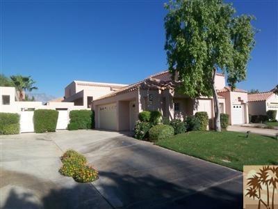 27 Oak Tree Drive Rancho Mirage, CA 92270 - Photo 9 of 21 a pathway of a house with a yard