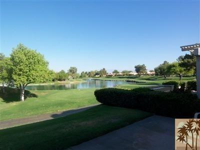 27 Oak Tree Drive Rancho Mirage, CA 92270 - Photo 10 of 21 a view of a lake with a yard