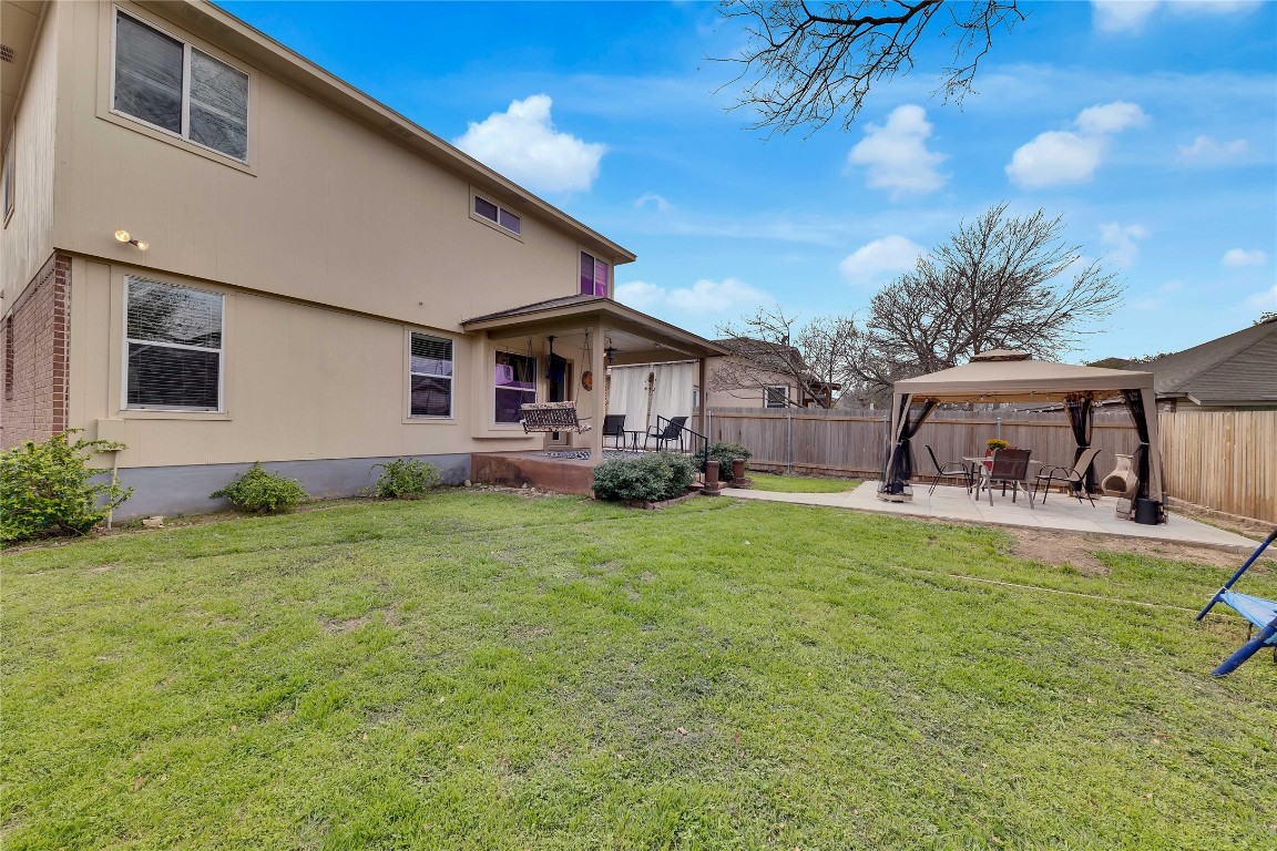a front view of house with yard and seating area