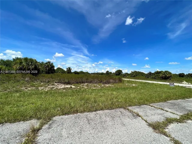 a view of lake with green space