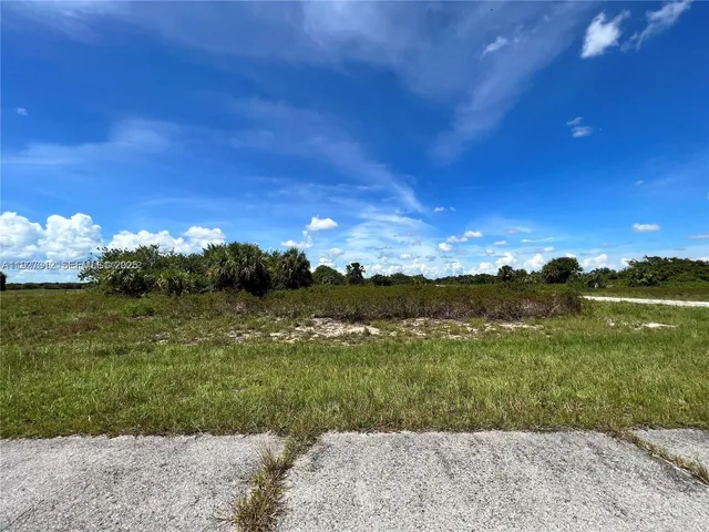 a view of a lake with a yard