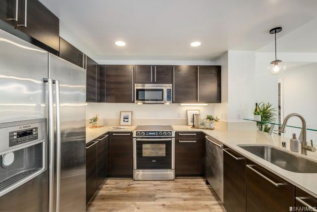 a bedroom with a large bed and a large window