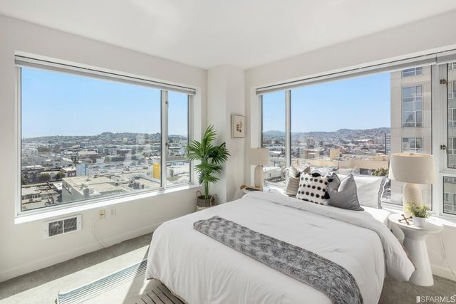a bathroom with a bathtub and a window