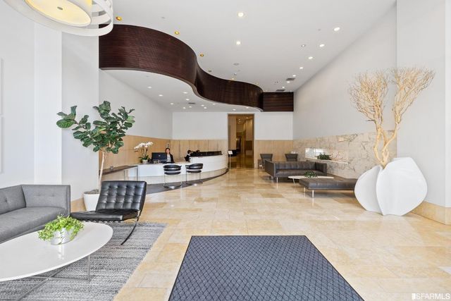 a living room with lots of furniture and gym equipment