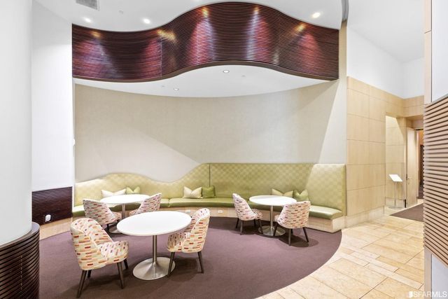 a view of a building with outdoor seating