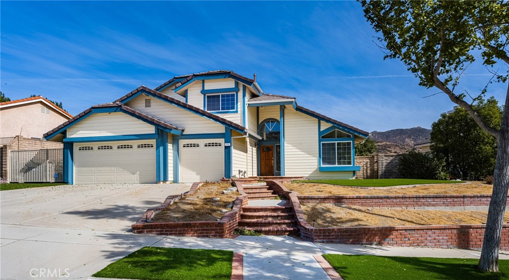 3250 North Geronimo Avenue Simi Valley, CA 93063 - Photo 2 of 47 a front view of a house with a yard