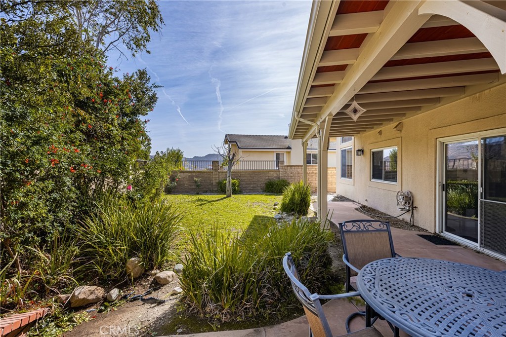 3250 North Geronimo Avenue Simi Valley, CA 93063 - Photo 27 of 47 a view of a patio with table and chairs and potted plants