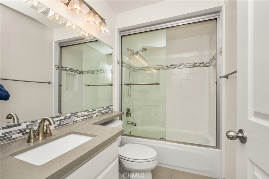 3250 North Geronimo Avenue Simi Valley, CA 93063 - Photo 33 of 47 a bathroom with a sink a toilet and shower