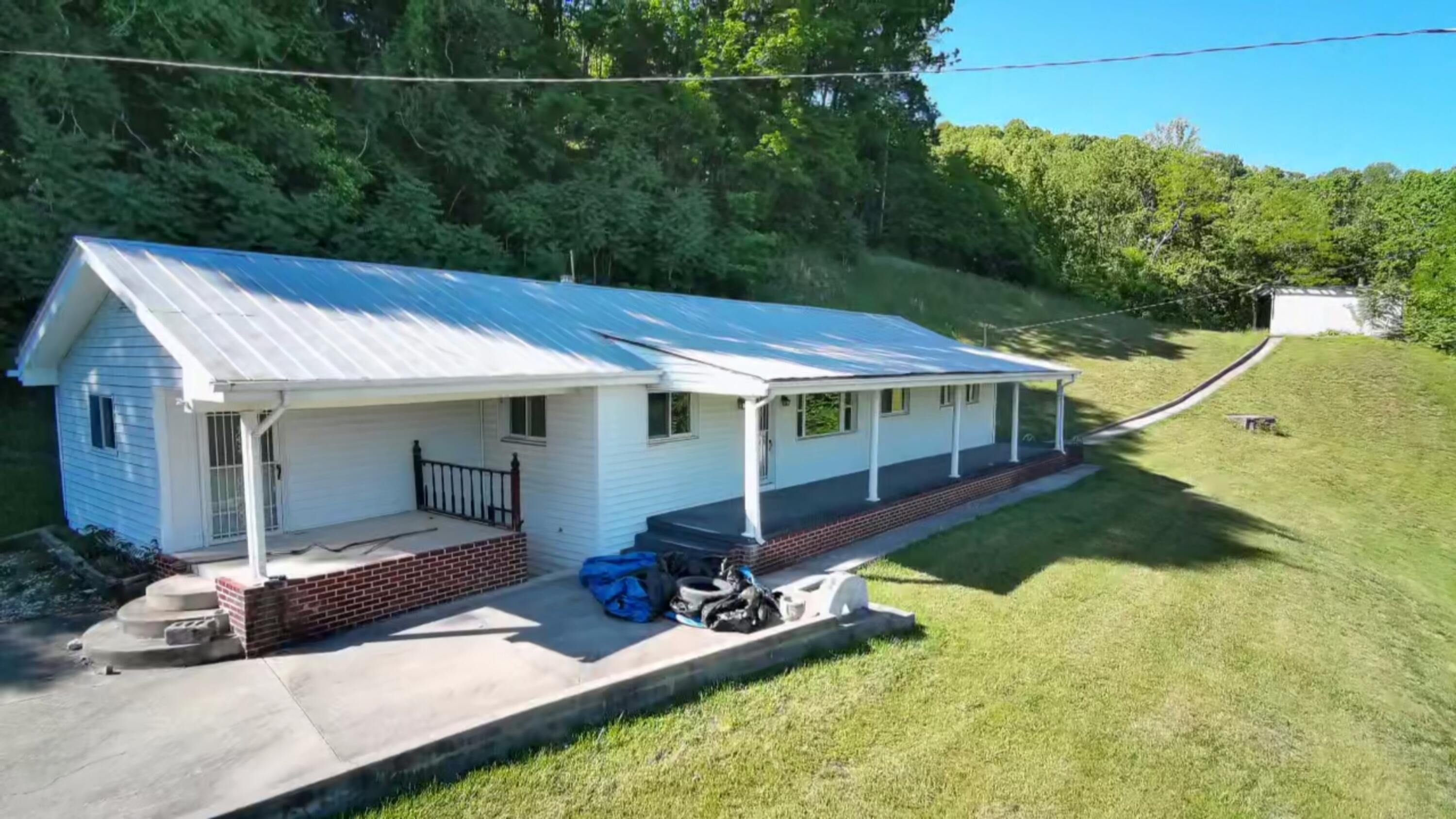 415 Stock Pen Mountain Road Narrows, VA 24124 - Photo 15 of 16 a view of house with backyard outdoor seating and plants