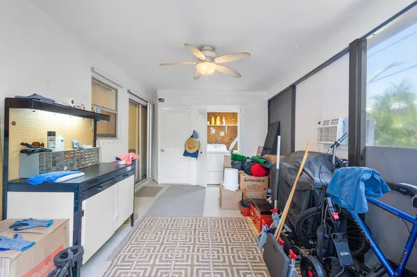 a view of a workspace with furniture and a flat screen tv