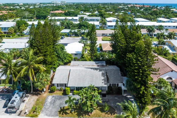 an aerial view of residential houses with outdoor space