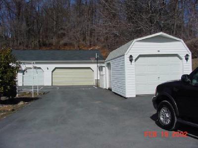 135 Morvale Road Easton, PA 18042 - Photo 2 of 3 a view of garage and car parked