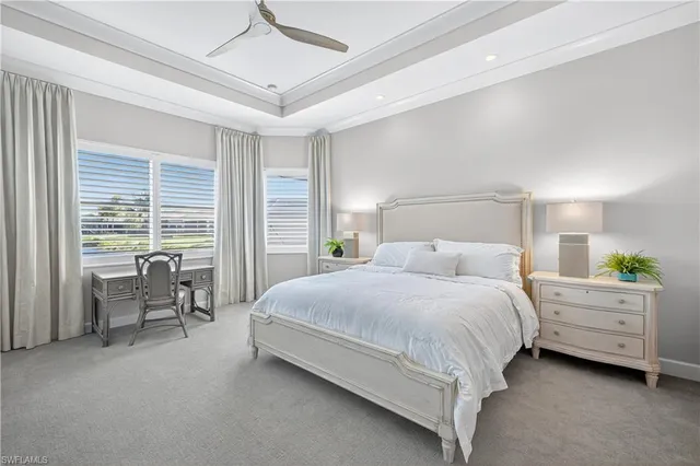 a bedroom with a large bed and white walls