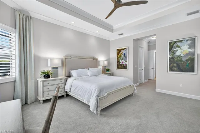 a bed room with furniture and a flat screen tv