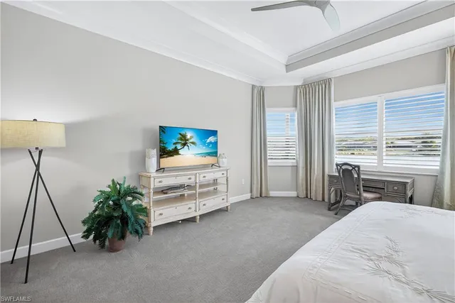 a bathroom with a granite countertop sink a mirror a vanity and shower