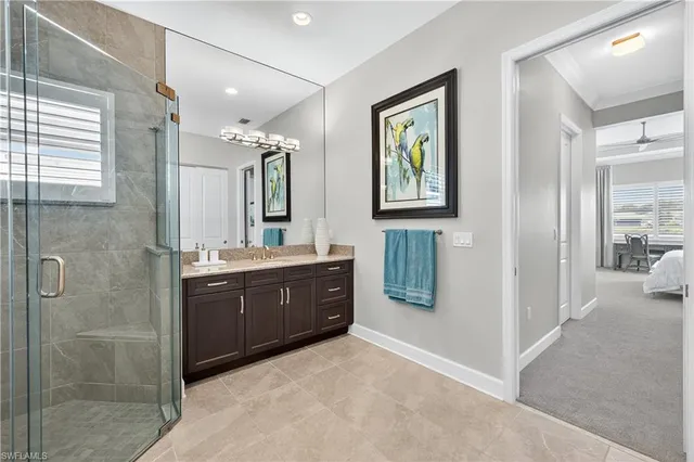 a spacious bathroom with a double vanity sink mirror and double