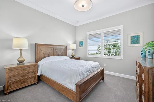 a bed room with a bed and a dresser