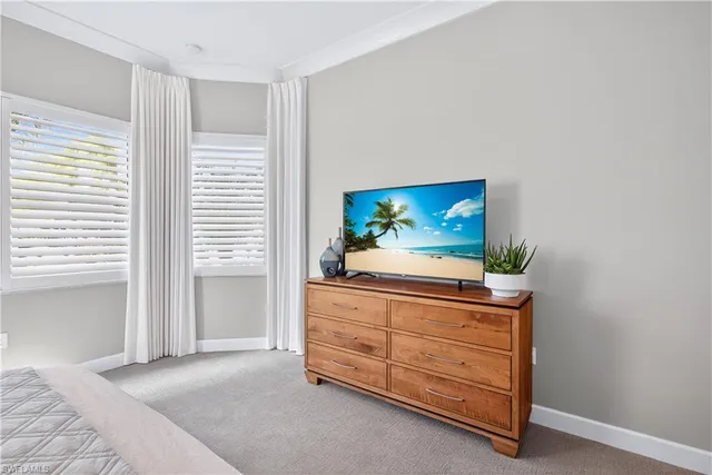 a bathroom with a granite countertop bathtub sink vanity mirror and toilet