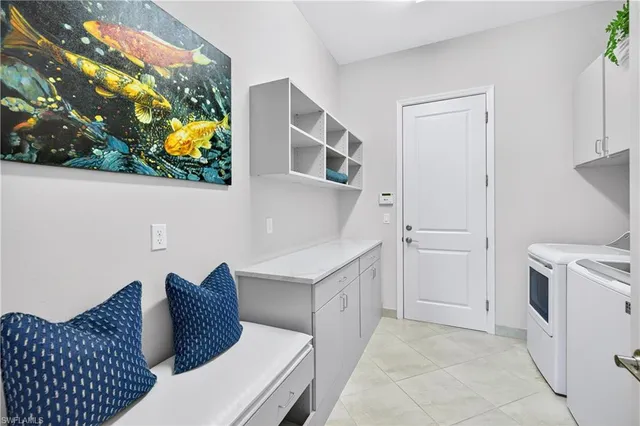 a view of a patio with a table and chairs under an umbrella