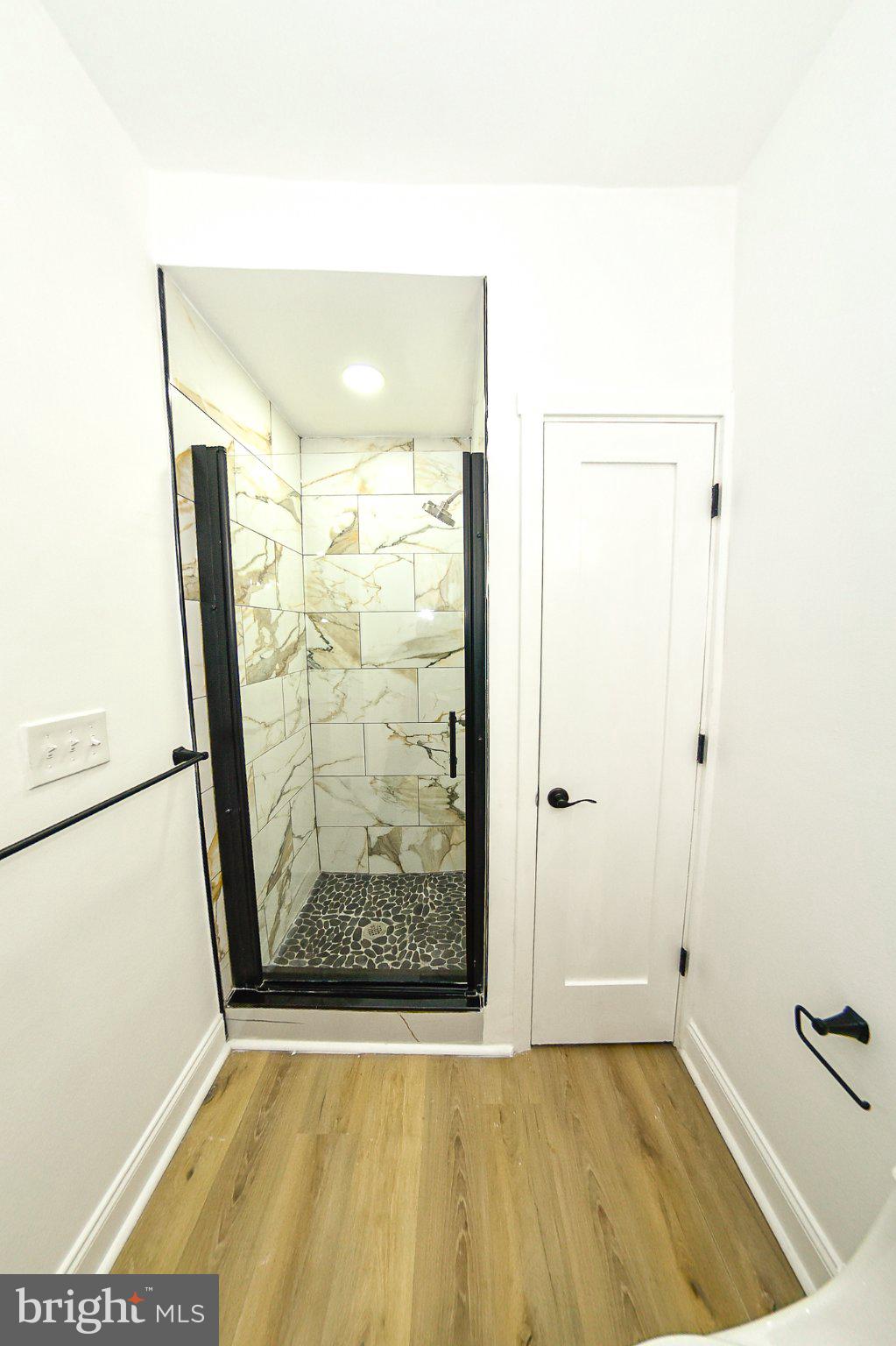 3704 Suitland Road Southeast Washington, DC 20020 - Photo 50 of 70 a view of a room with wooden floor and a hallway
