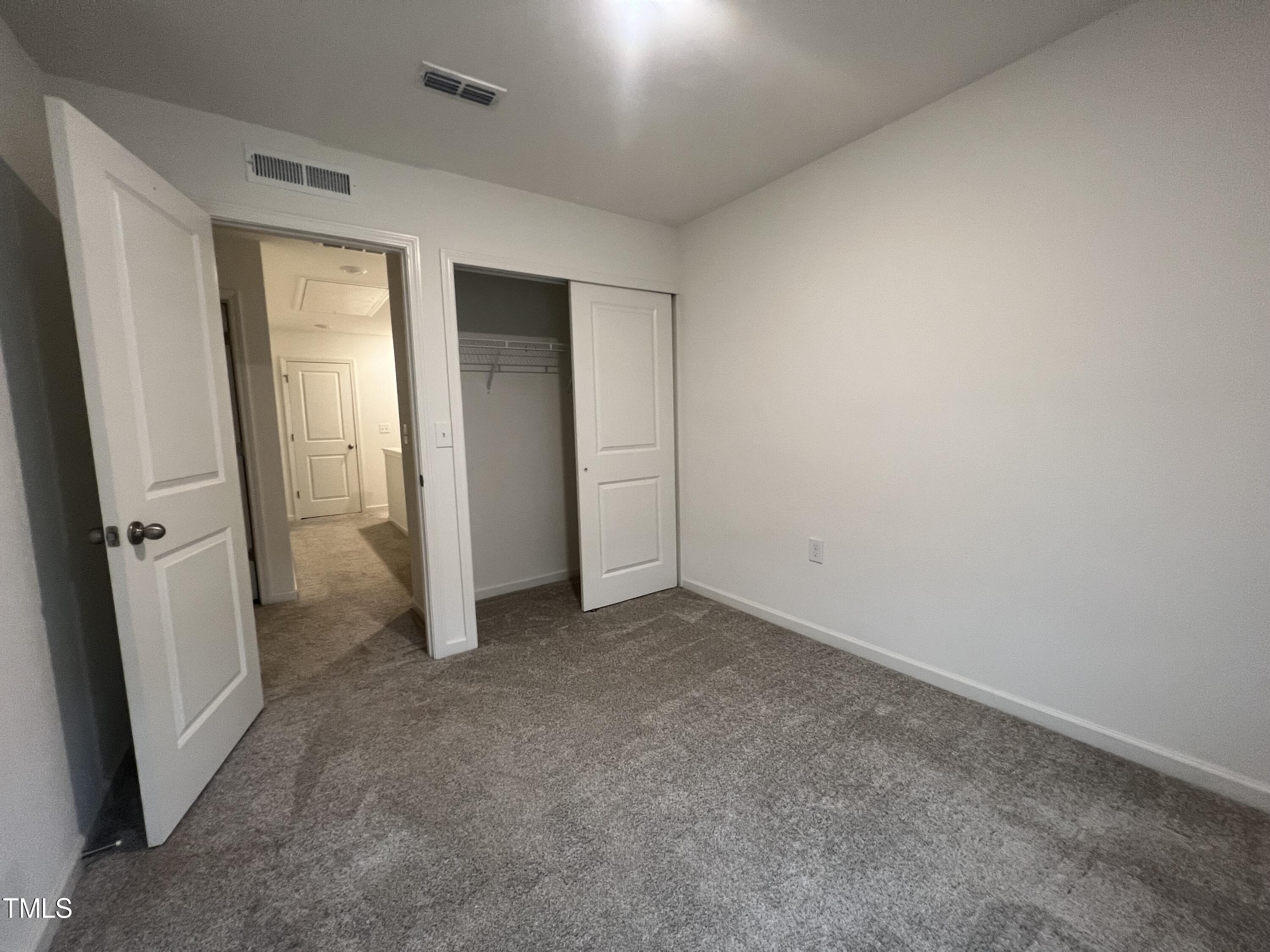 3118 Crater Loop Raleigh, NC 27610 - Photo 14 of 14 an empty room with windows