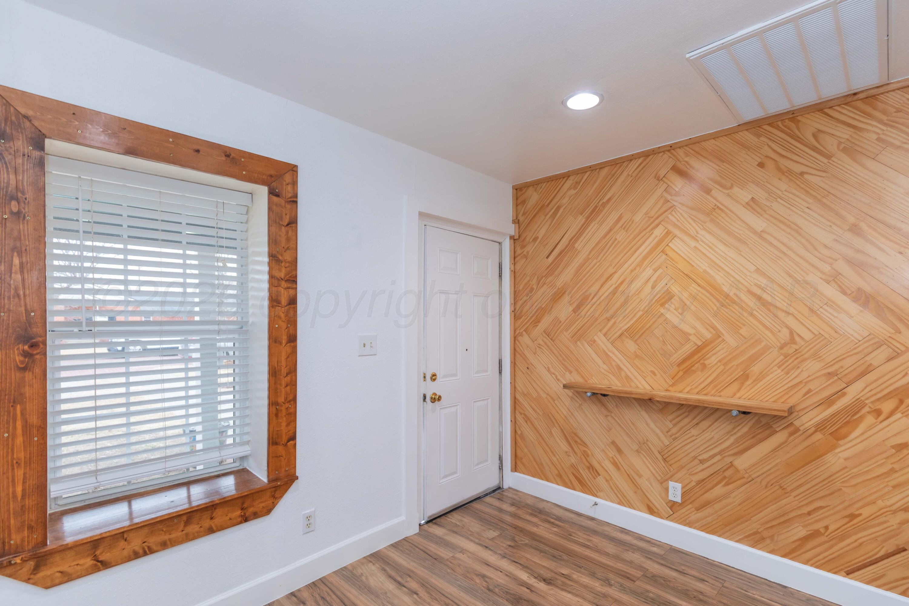 1503 7th Avenue Canyon, TX 79015 - Photo 11 of 30 a view of hallway with wooden floor