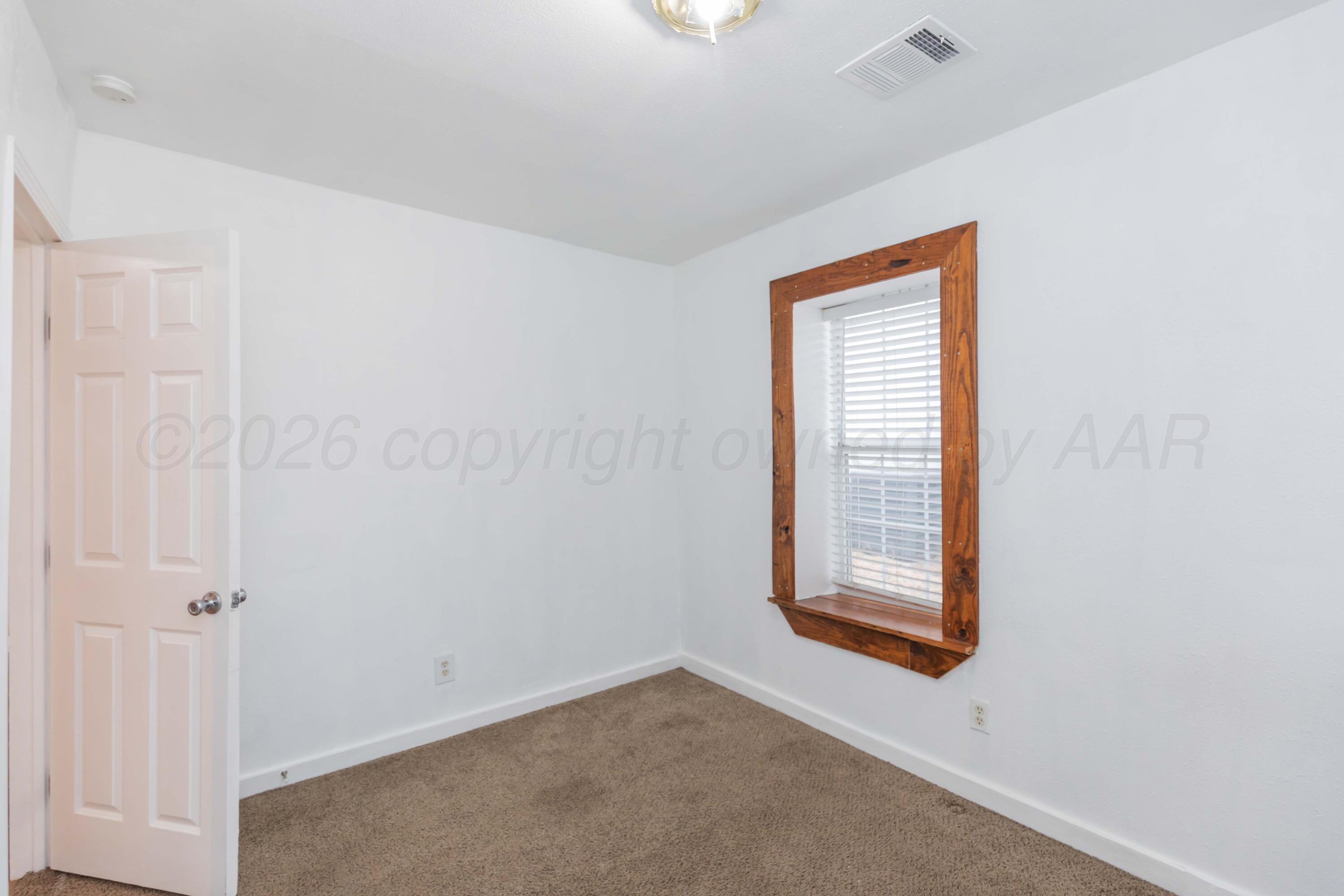 1503 7th Avenue Canyon, TX 79015 - Photo 20 of 30 a view of an empty room with a window