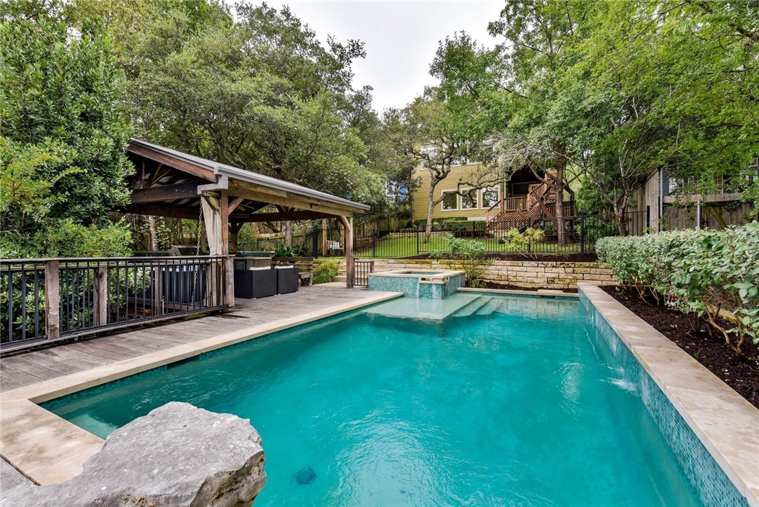 a view of a house with backyard porch and sitting area