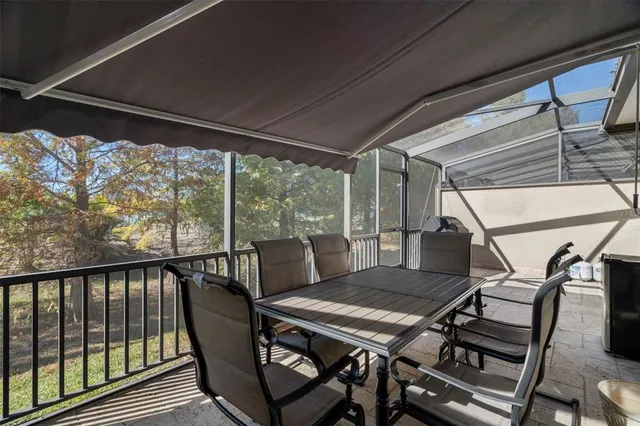 a view of balcony with furniture and wooden floor