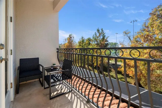 a view of a chairs and table in patio