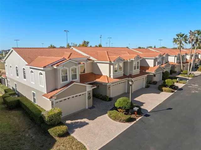 an aerial view of a house with porch and furniture