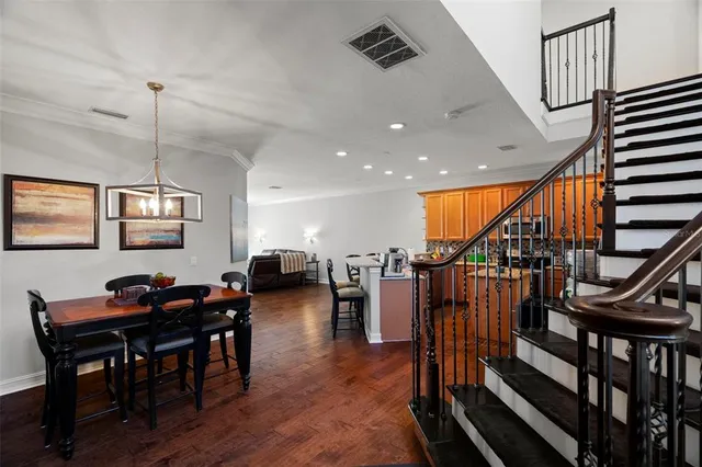 a living room with lots of furniture and a wooden floor
