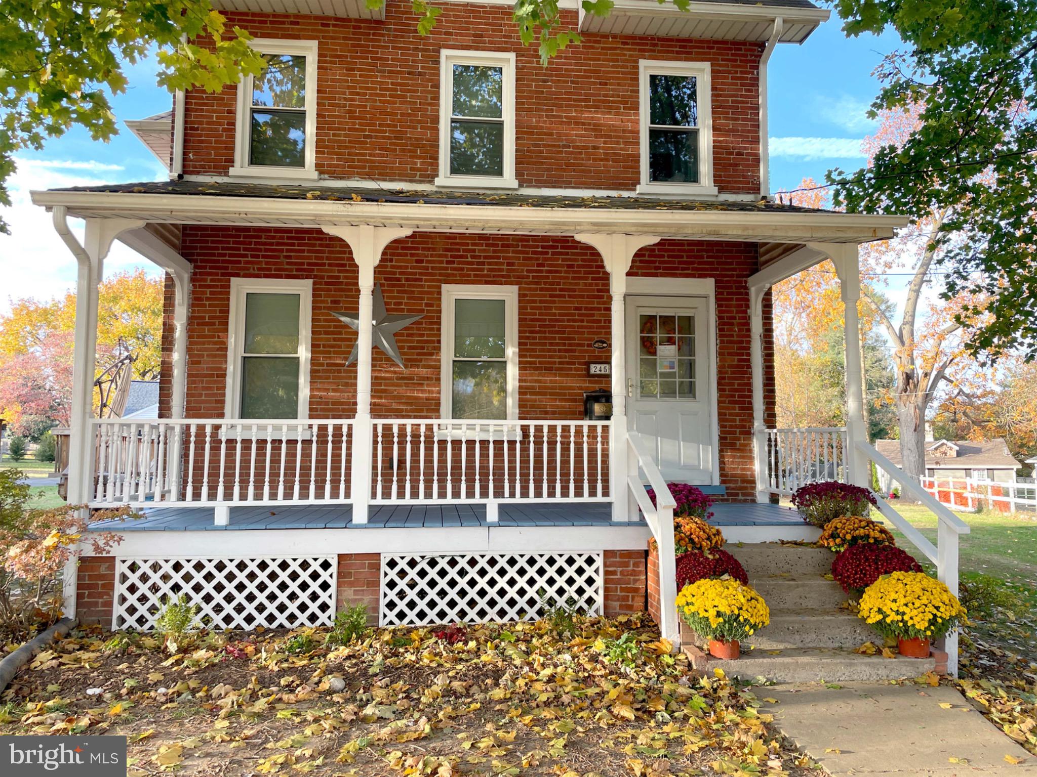 front view of a house with a large window