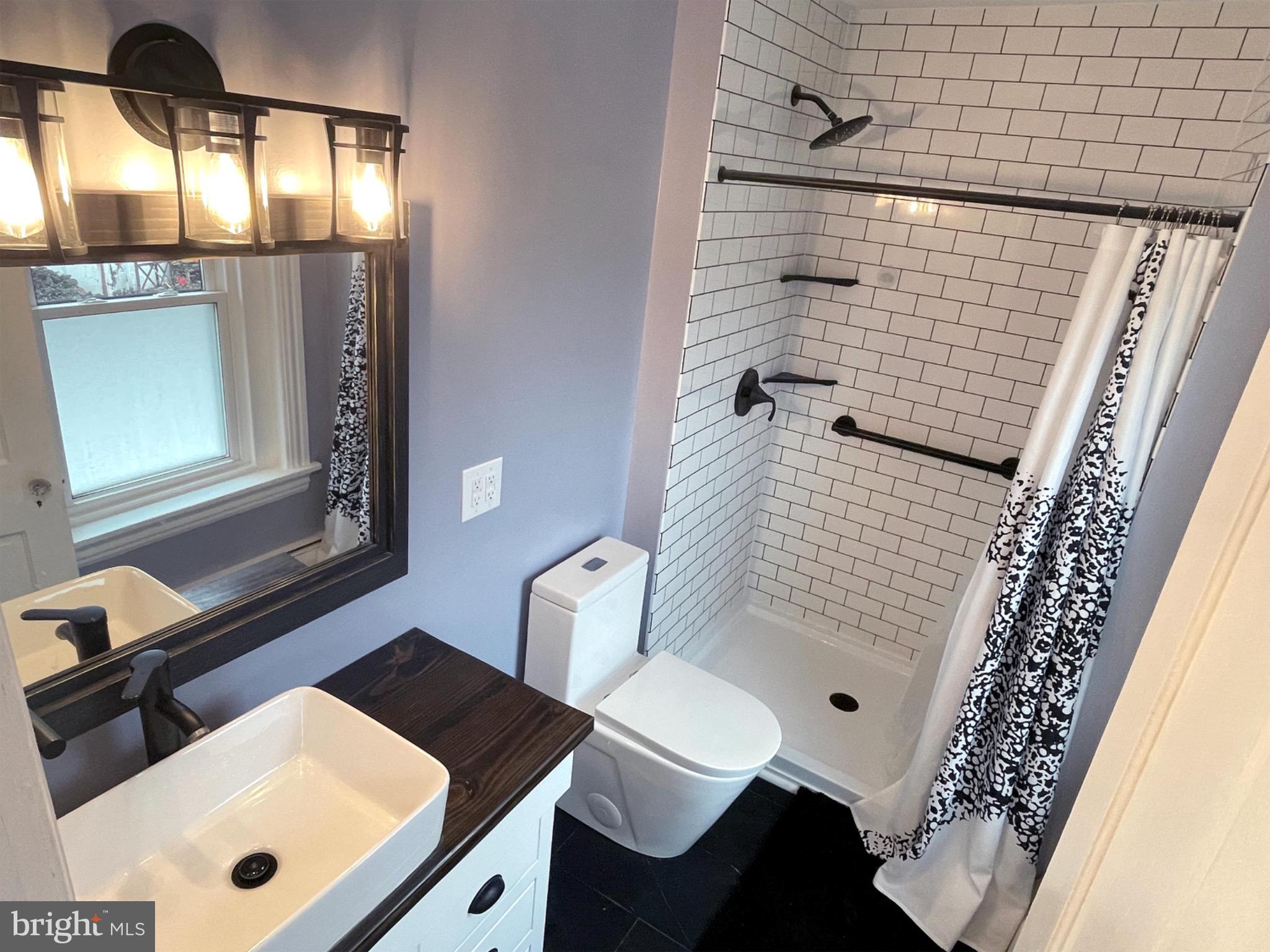 245 Maple Street Oxford, PA 19363 - Photo 13 of 23 a bathroom with a sink and a mirror