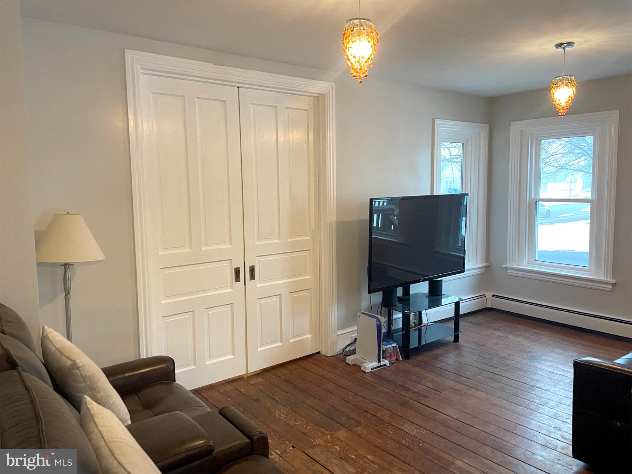 245 Maple Street Oxford, PA 19363 - Photo 2 of 23 a living room with furniture and a flat screen tv