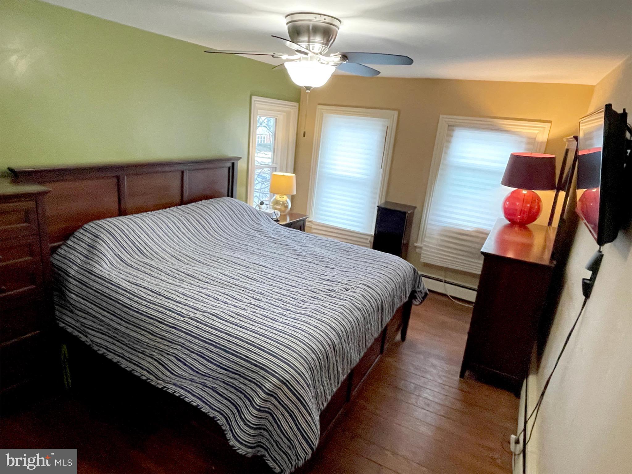 245 Maple Street Oxford, PA 19363 - Photo 10 of 23 a bedroom with bed and wooden floor