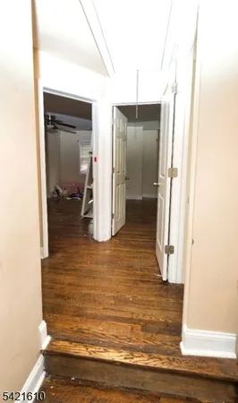 a workspace with wooden floor and a window