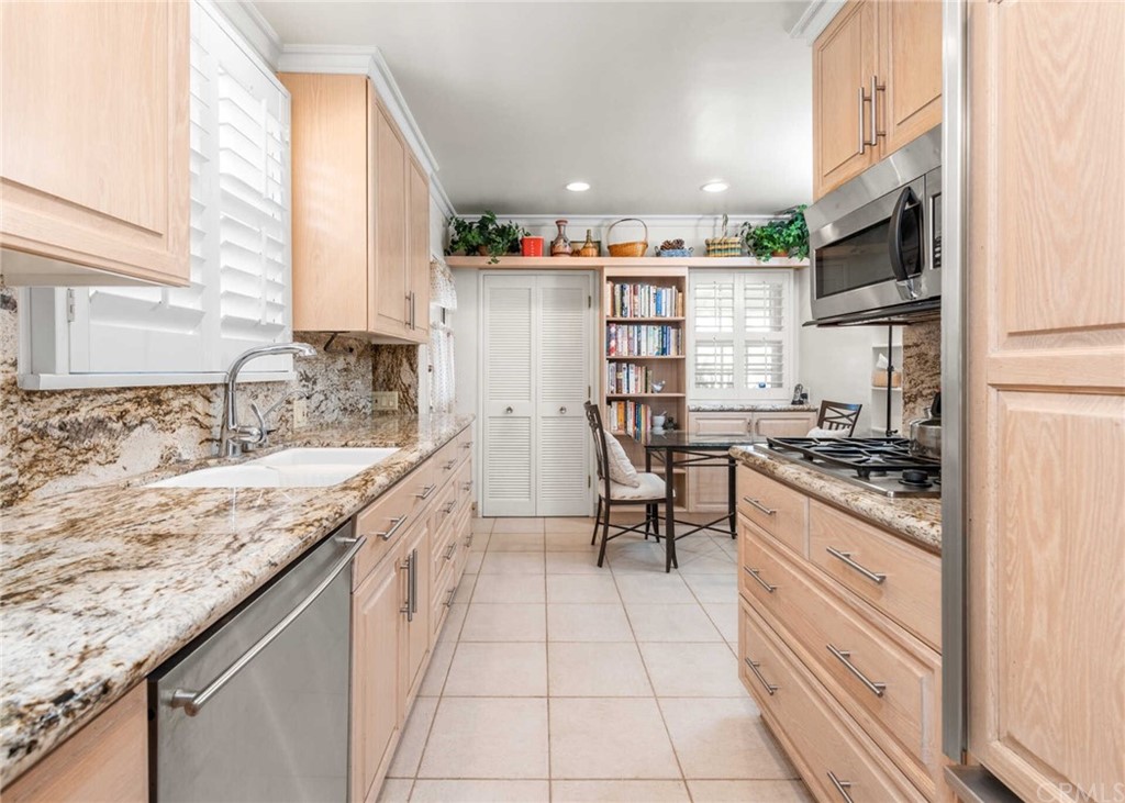 3381 Colbert Avenue Mar Vista, CA 90066 - Photo 8 of 23 a kitchen with stainless steel appliances granite countertop a stove and a sink