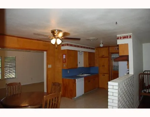 a kitchen that has a lot of cabinets