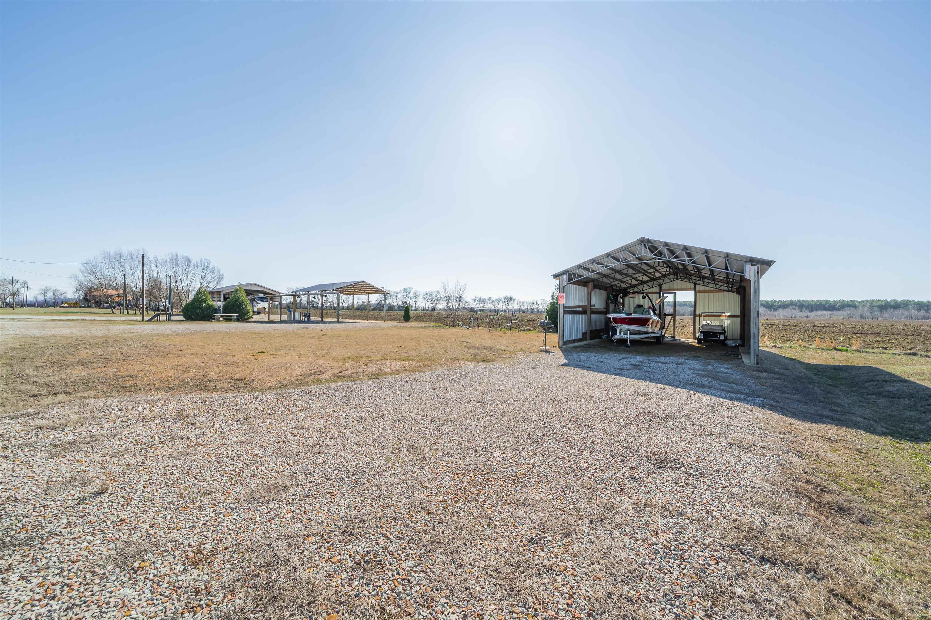 233 Jaycee Lane Adamsville, TN 38310 - Photo 11 of 18 a car parked on the side of the ocean