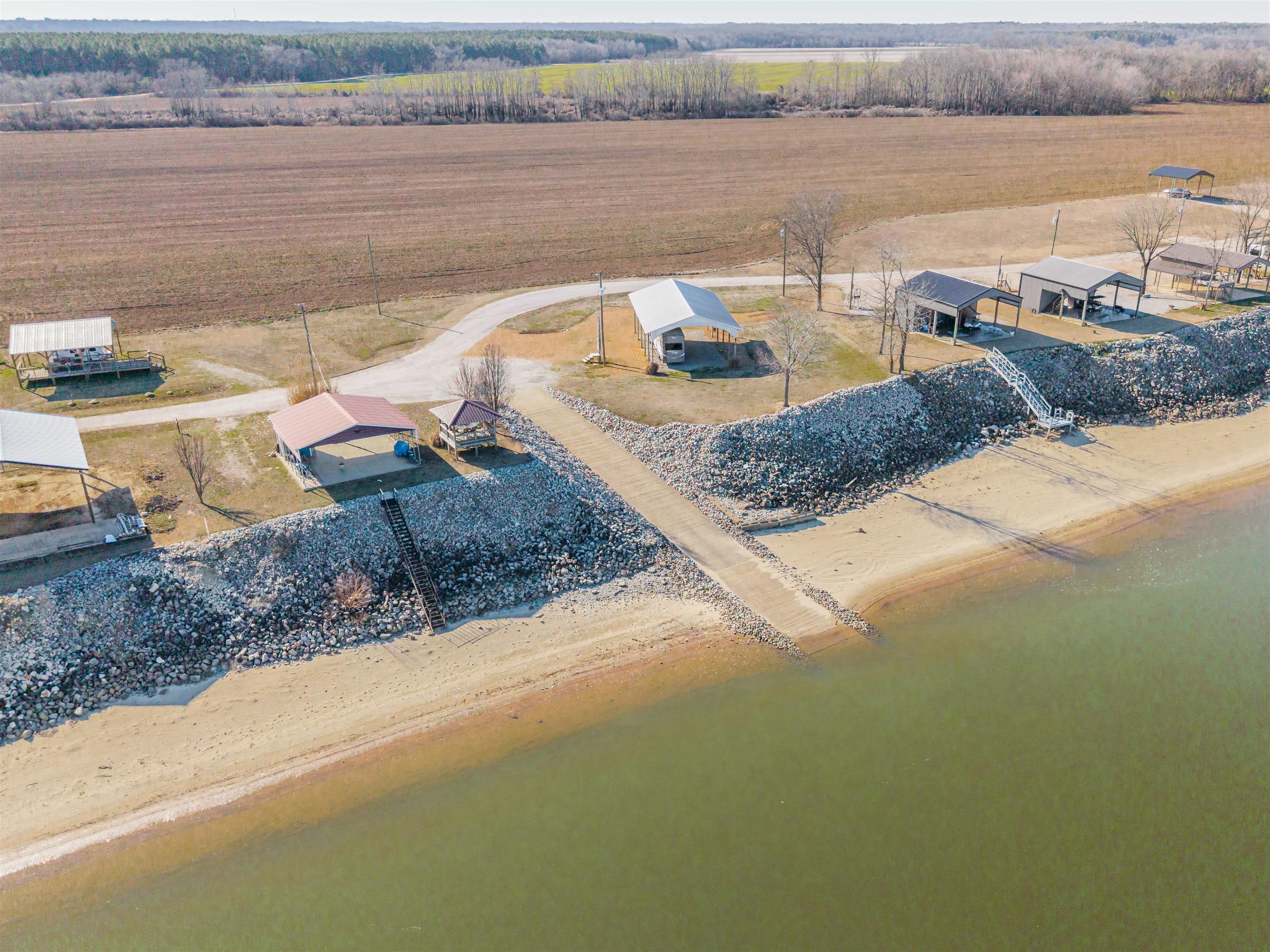 233 Jaycee Lane Adamsville, TN 38310 - Photo 17 of 18 a view of a lake with outdoor space