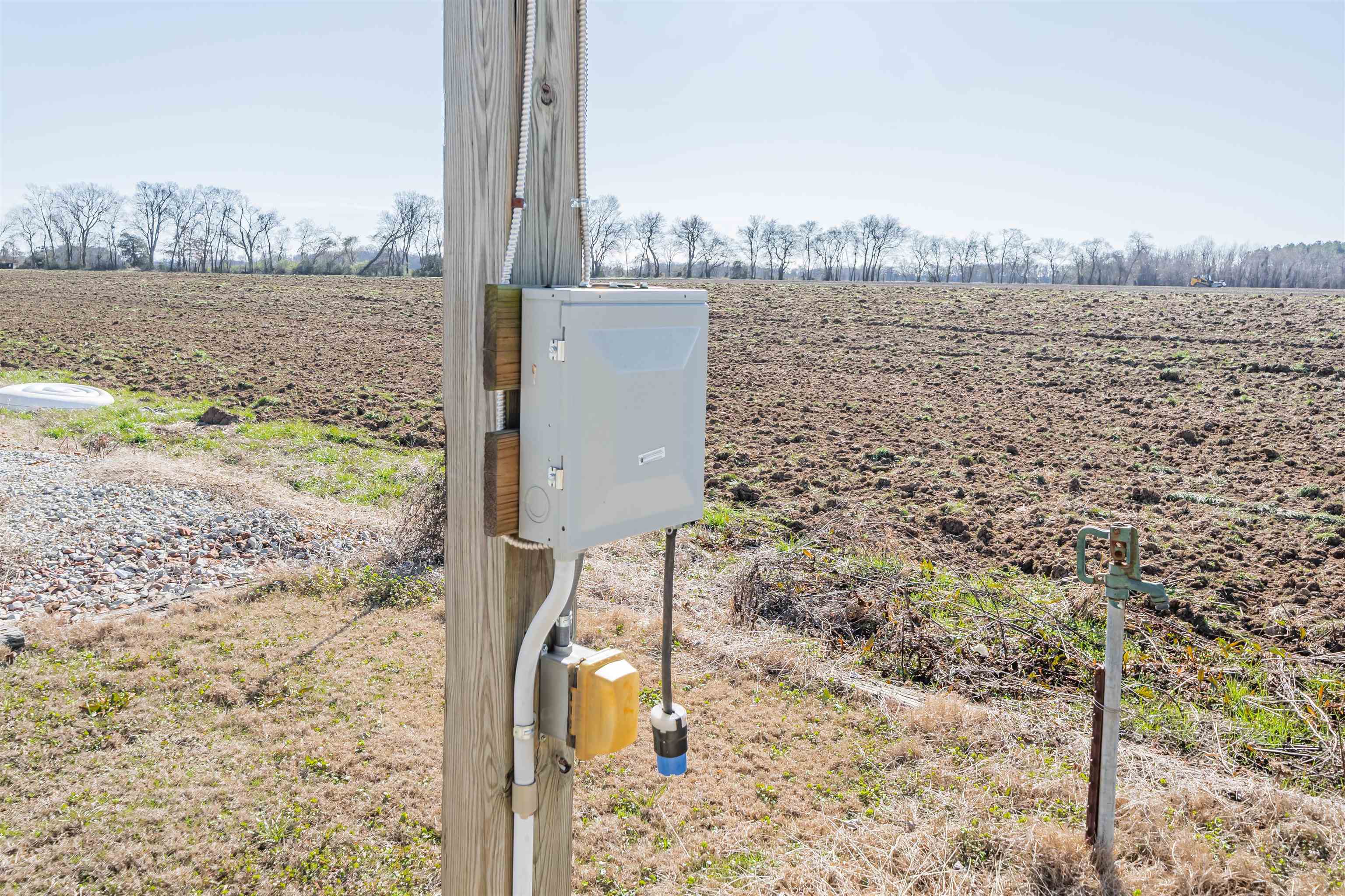233 Jaycee Lane Adamsville, TN 38310 - Photo 4 of 18 a view of a lake next to a building with a lake