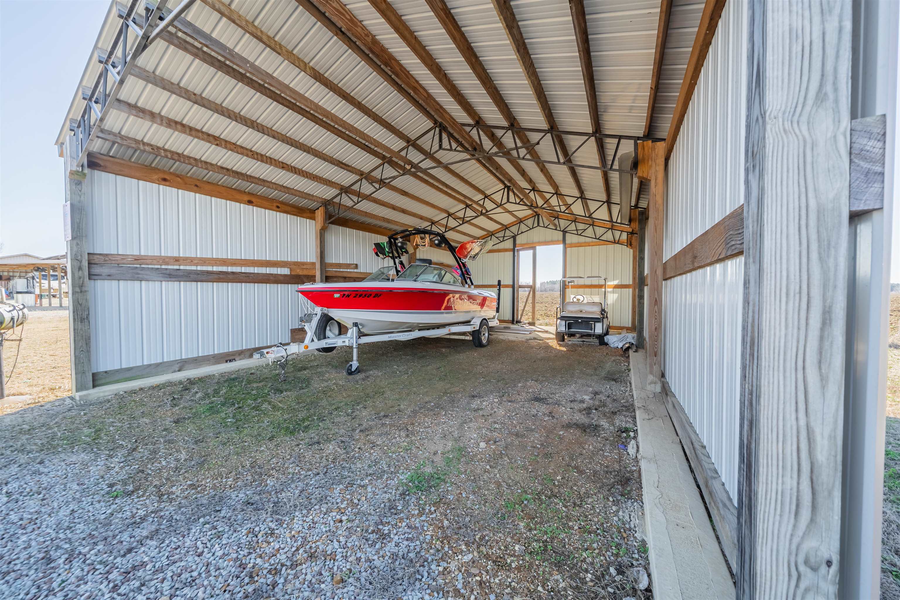 233 Jaycee Lane Adamsville, TN 38310 - Photo 9 of 18 a view of a room with wooden walls and stairs